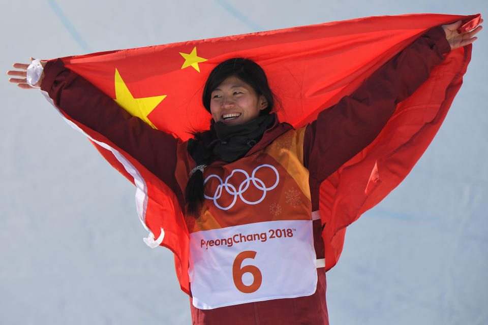 Silver medallist China's Liu Jiayu celebrates during the victory ceremony after the women's snowboard halfpipe final on Feb. 13, 2018. | Loic Venance—AFP/Getty Images: