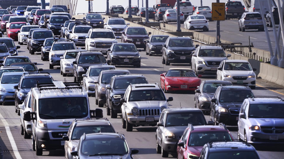 Bumper to bumper northbound traffic rolls across the Zakim Bridge into Boston on Wednesday, July 14, 2021. Drivers went bonkers on the nation's largely empty roads during the pandemic, and the risky behavior shows no sign of easing. In fact, it's more dangerous than ever with the addition of heavy traffic this summer. Motorists are speeding, tailgating and zigzagging through holiday traffic from Maine to California. (AP Photo/Charles Krupa)