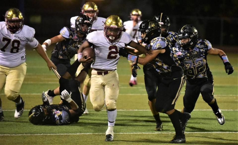 Golden Valley High School running back Jahkylle Smith (2) runs the ball against Buhach Colony on Friday, Sept. 16, 2022 at Dave Honey Stadium in Atwater, Calif. Smith ran for 210 yards and four touchdowns in the Cougars’ 48-23 win.