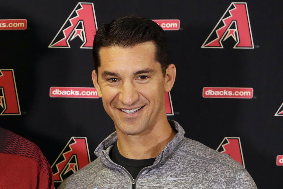 FILE - Arizona Diamondbacks general manager Mike Hazen smiles during a press conference, Monday, Feb. 12, 2018, in Scottsdale, Ariz. Hazen has received a new contact through the 2028 season with a club option for 2029, according to a person familiar with the deal. (AP Photo/Rick Scuteri, File)