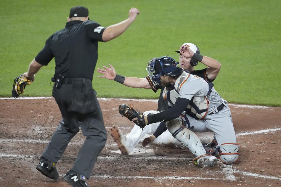Orioles first baseman Ryan Mountcastle beats the tag by Tigers catcher Eric Haase in the ninth inning to score the winning run during the Tigers' 2-1 loss on Friday, April 21, 2023, in Baltimore.