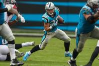 Nov 5, 2017; Charlotte, NC, USA; Carolina Panthers running back Christian McCaffrey (22) runs for yardage against the Atlanta Falcons during the second half at Bank of America Stadium. Jim Dedmon-USA TODAY Sports