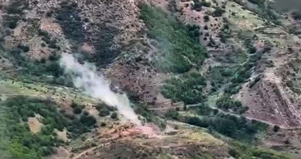 In this photo taken from video released by Defense Ministry of Azerbaijan on Tuesday, Sept. 19, 2023, smoke rises over an area which Azerbaijan says hosts Armenian forces' positions in the breakaway territory of Nagorno-Karabakh in Azerbaijan. Azerbaijan on Tuesday declared that it started what it called an "anti-terrorist operation" targeting Armenian military positions in the Nagorno-Karabakh region and officials in that region said there was heavy artillery firing around its capital. (Defense Ministry of Azerbaijan via AP)