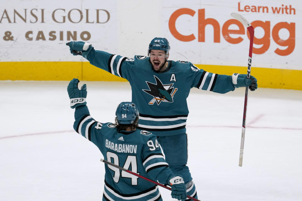 San Jose Sharks center Tomas Hertl, rear, celebrates with left wing Alexander Barabanov (94) after scoring against the New York Rangers during overtime in an NHL hockey game Tuesday, Jan. 23, 2024, in San Jose, Calif. (AP Photo/Godofredo A. Vásquez)