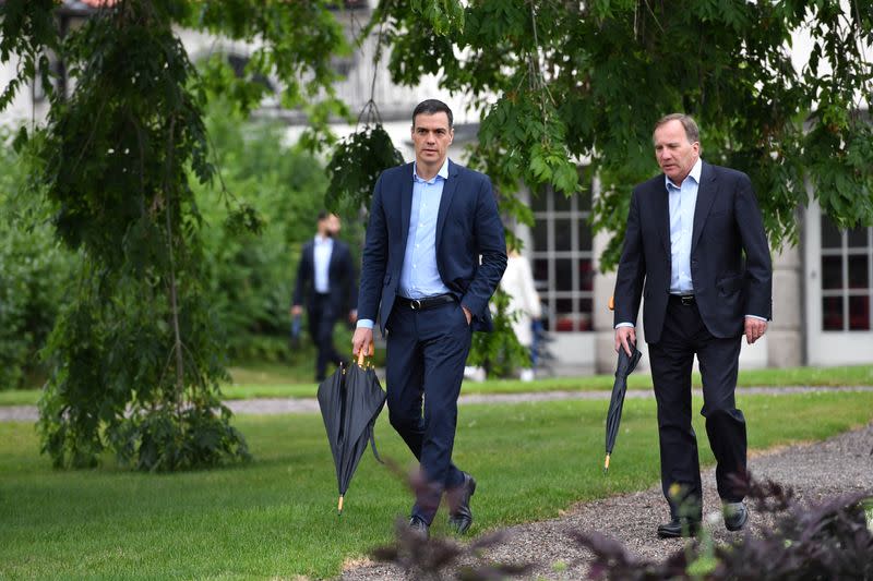 Spanish Prime Minister Pedro Sanchez and Sweden's Prime Minister Stefan Lofven walk during their meeting in Harpsund