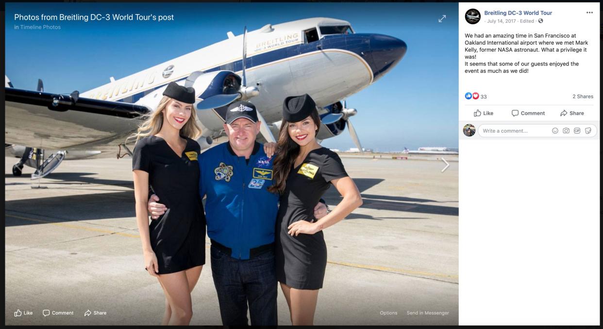 Democratic Senate candidate Mark Kelly poses with models at a Breitling event. (Photo: Facebook screenshot)