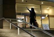 A protester stands on the steps of city hall as members of the black community attend a open community forum to speak to the city council in Charlotte, North Carolina, September 26, 2016. REUTERS/Mike Blake