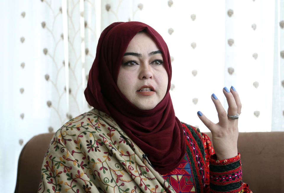 In this Sunday, Oct. 14, 2018 photo, Hameeda Danesh, a candidate for Parliament, hoping to represent the deeply conservative district of Jalrez in central Wardak province, speaks during an interview with The Associated Press, in Kabul, Afghanistan. In Saturday’s election 417, or roughly 16 percent, of the 2,565 candidates competing for seats in the 249-member chamber are women. Yet in rural Afghanistan, especially in the country’s ethnic Pashtun areas where the Taliban dominate, many women are not even registered to vote. (AP Photo/Rahmat Gul)