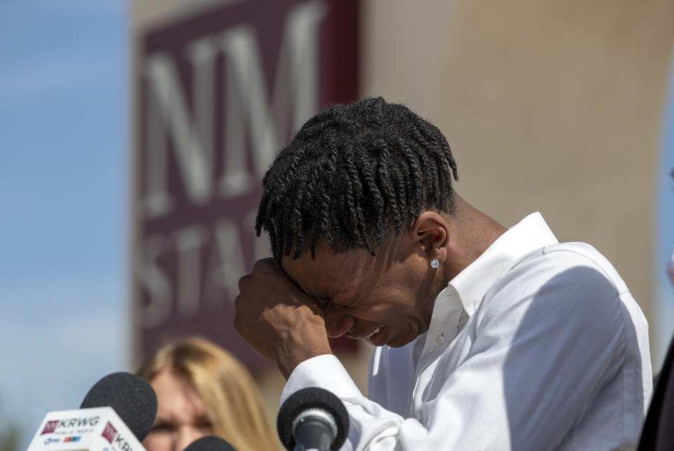 Former New Mexico State NCAA college basketball player Deuce Benjamin breaks down in tears while speaking at a news conference in Las Cruces, N.M., Wednesday, May 3, 2023. Benjamin and former Aggie player Shak Odunewu discussed the lawsuit they filed alleging teammates ganged up and sexually assaulted them multiple times, while their coaches and others at the school didn't act when confronted with the allegations. (AP Photo/Andres Leighton)