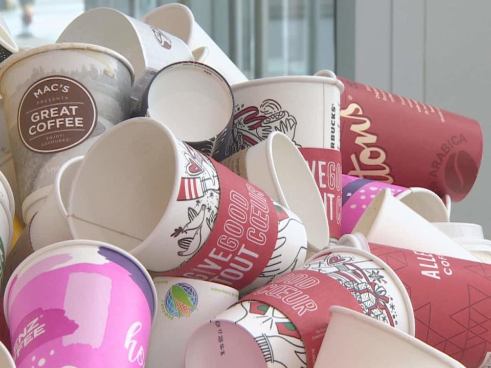 The City of Vancouver's cup bylaw has been in place since January 2022, compelling businesses to charge 25 cents per disposable cup. (Nic Amaya/CBC - image credit)