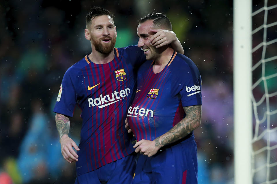 Paco Alcacer (R) and Lionel Messi celebrate one of Alcacer’s two goals in Barcelona’s match vs. Sevilla. (Getty)
