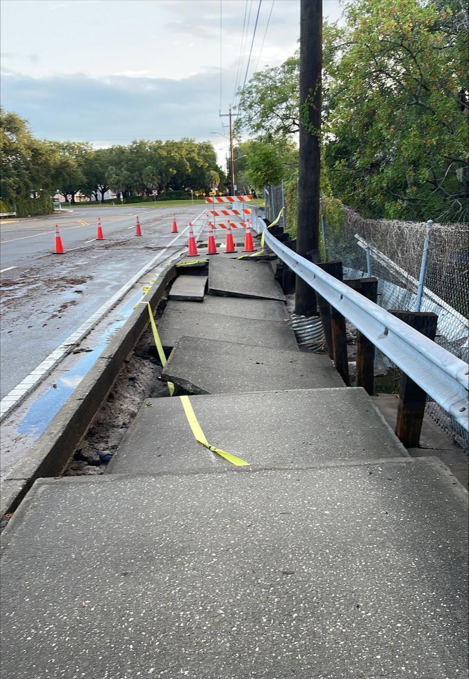 A photo provided by Sarasota County shows the collapsed sidewalk along Tuttle Ave. near the Phillippi Creek Bridge Wednesday morning.