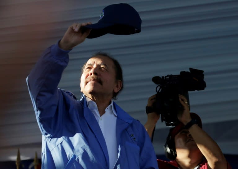 Nicaraguan President Daniel Ortega waves to supporters during a rally in Managua