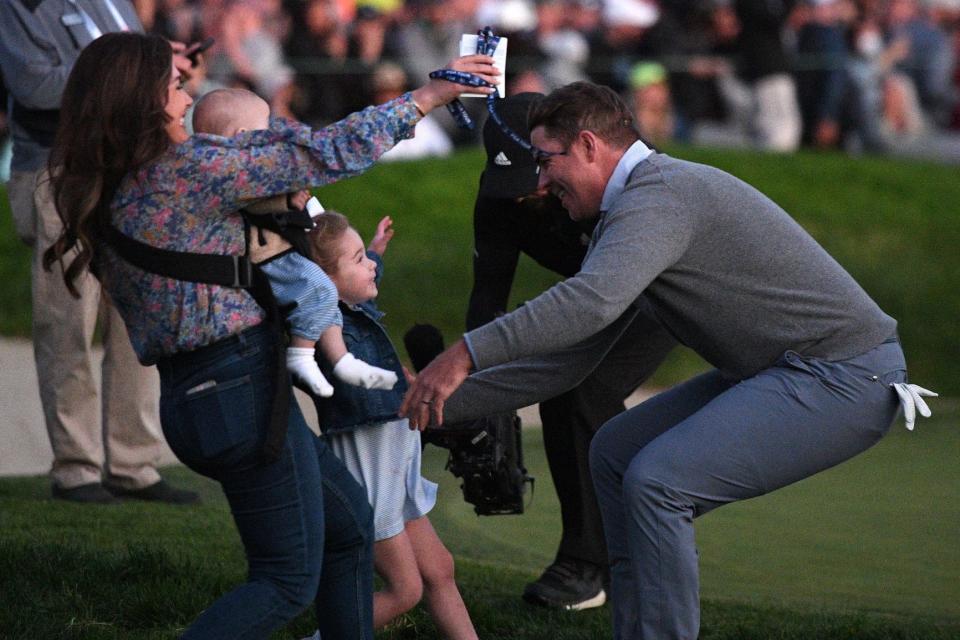 Luke List celebrates with his wife and two children after winning the Farmers Insurance Open in January at Torrey Pines.