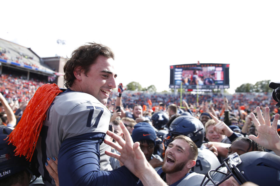 James McCourt #17 of the Illinois Fighting Illini is lifted up after a 39-yard field goal against the Wisconsin Badgers as time expired to win the game. (Getty)