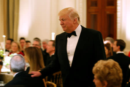 U.S. President Donald Trump walks after speaking during the Governor's Dinner in the State Dining Room at the White House in Washington, U.S., February 26, 2017. REUTERS/Joshua Roberts
