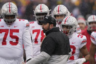 Ohio State head coach Ryan Day talks to the team during the first half of an NCAA college football game against Michigan, Saturday, Nov. 27, 2021, in Ann Arbor, Mich. (AP Photo/Carlos Osorio)