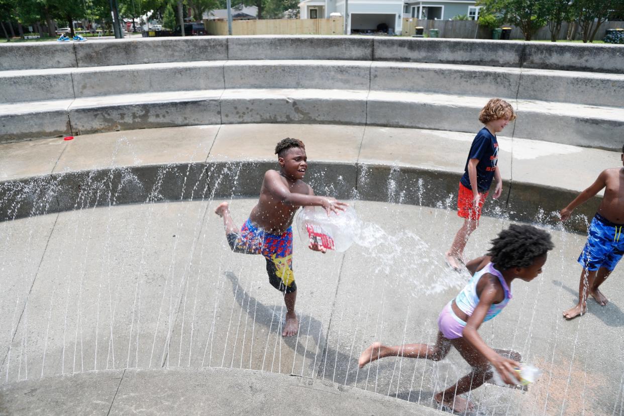 How about a cool splash of water? Children play in the spray area at Hull Park on Tuesday June 14, 2022 as the heat index climbed to over 100 degrees for the 2nd day in a row.