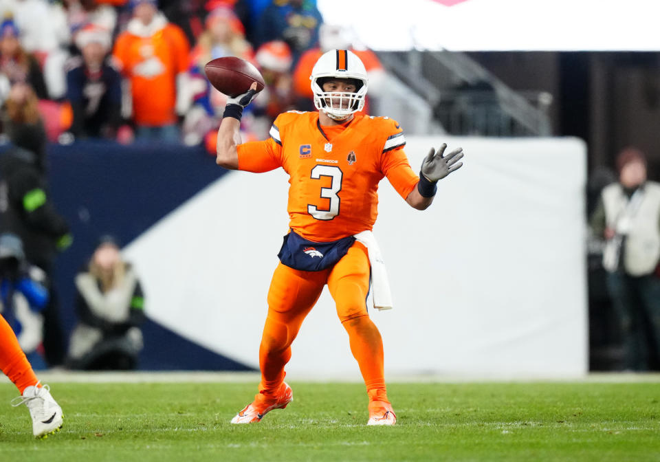 Dec 24, 2023; Denver, Colorado, USA; Denver Broncos quarterback Russell Wilson (3) prepares to pass in the first half against the New England Patriots at Empower Field at Mile High. Mandatory Credit: Ron Chenoy-USA TODAY Sports