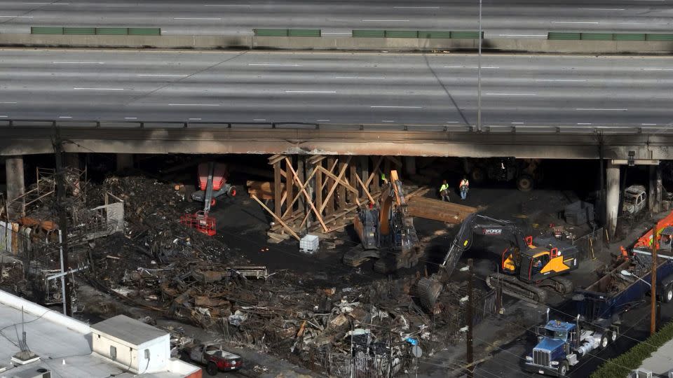 The site of a fire is shown under Interstate 10, in an aerial view, Monday, Nov. 13, 2023, in Los Angeles. - Jae C. Hong/AP