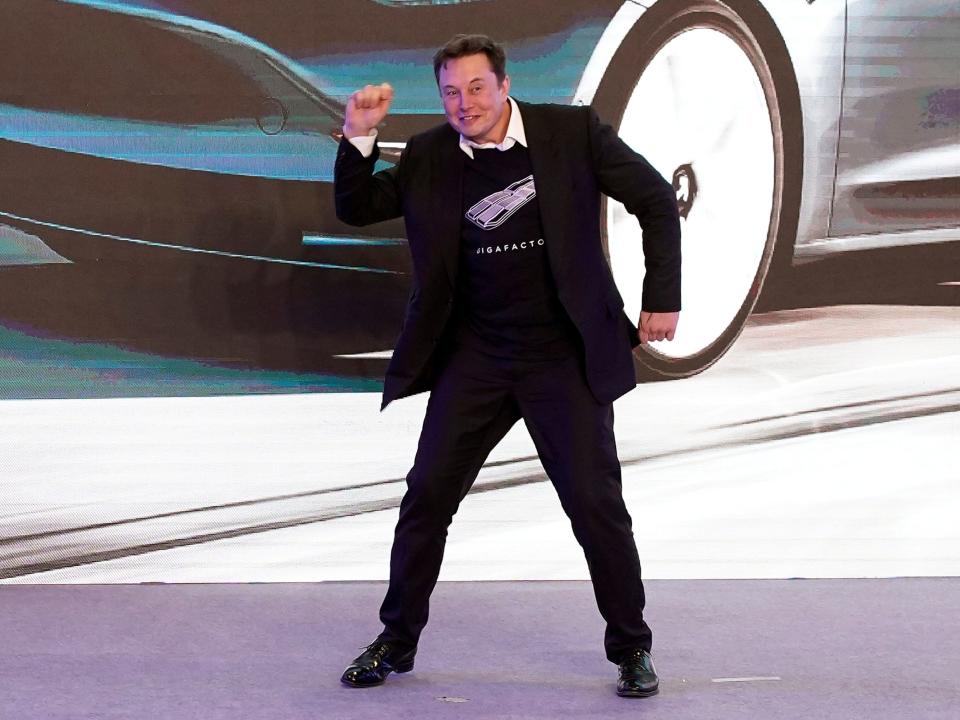 FILE PHOTO: Tesla Inc CEO Elon Musk dances onstage during a delivery event for Tesla China-made Model 3 cars in Shanghai, China January 7, 2020. REUTERS/Aly Song/File Photo