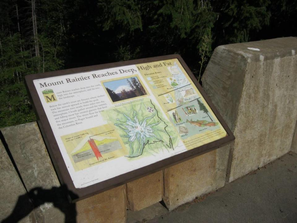 Signs posted at Palisades Viewpoint include information about the structure and Mount Rainier’s impacts.