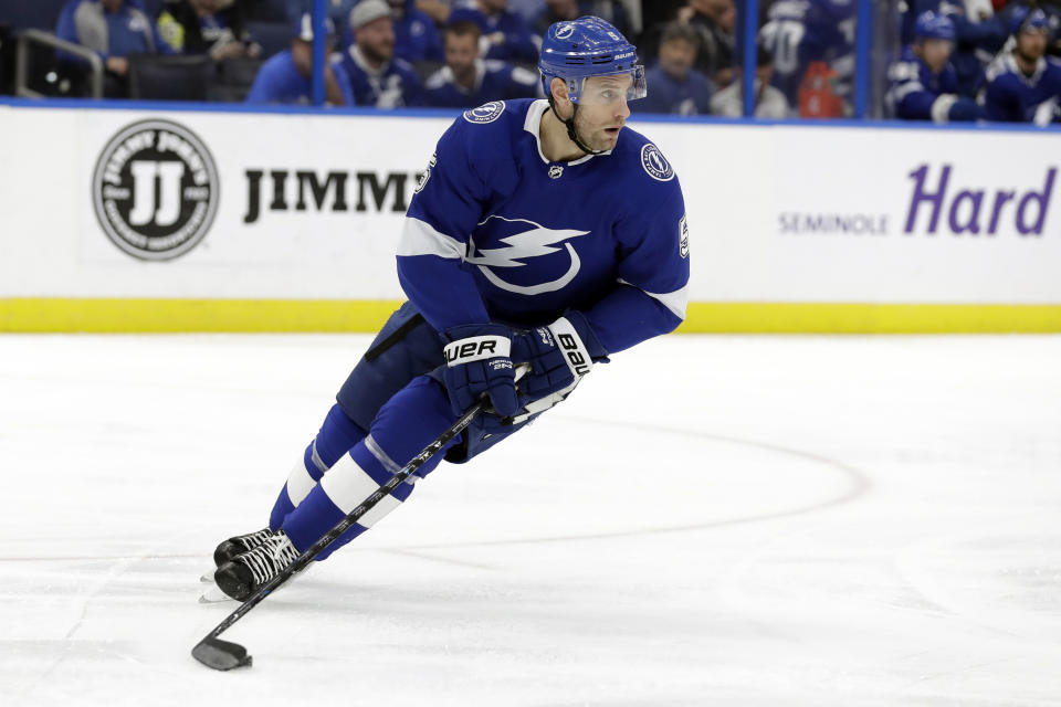 FILE - In this Jan. 17, 2019, file photo, Tampa Bay Lightning defenseman Dan Girardi skates with the puck during the first period of an NHL hockey game against the Toronto Maple Leafs in Tampa, Fla. The former New York Rangers and Tampa Bay Lightning defenseman has announced his retirement from the NHL after 13 seasons on Friday, Sept. 20, 2019. (AP Photo/Chris O'Meara, File)