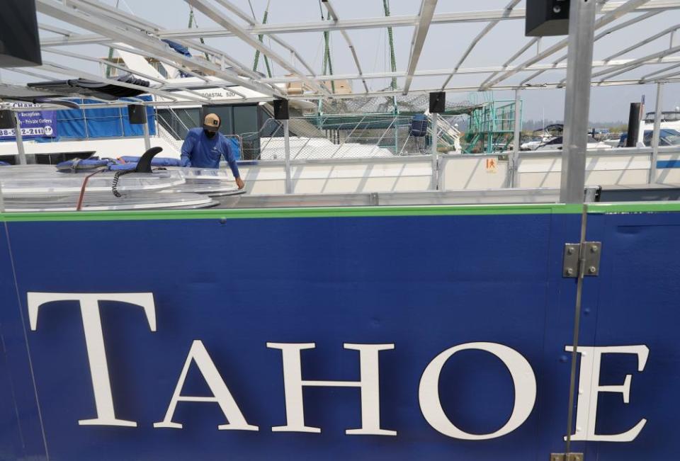 Ludovic Fekete, an employee at Clearly Tahoe, checks on the company’s transparent kayaks after returning from being evacuated because of wildfire.