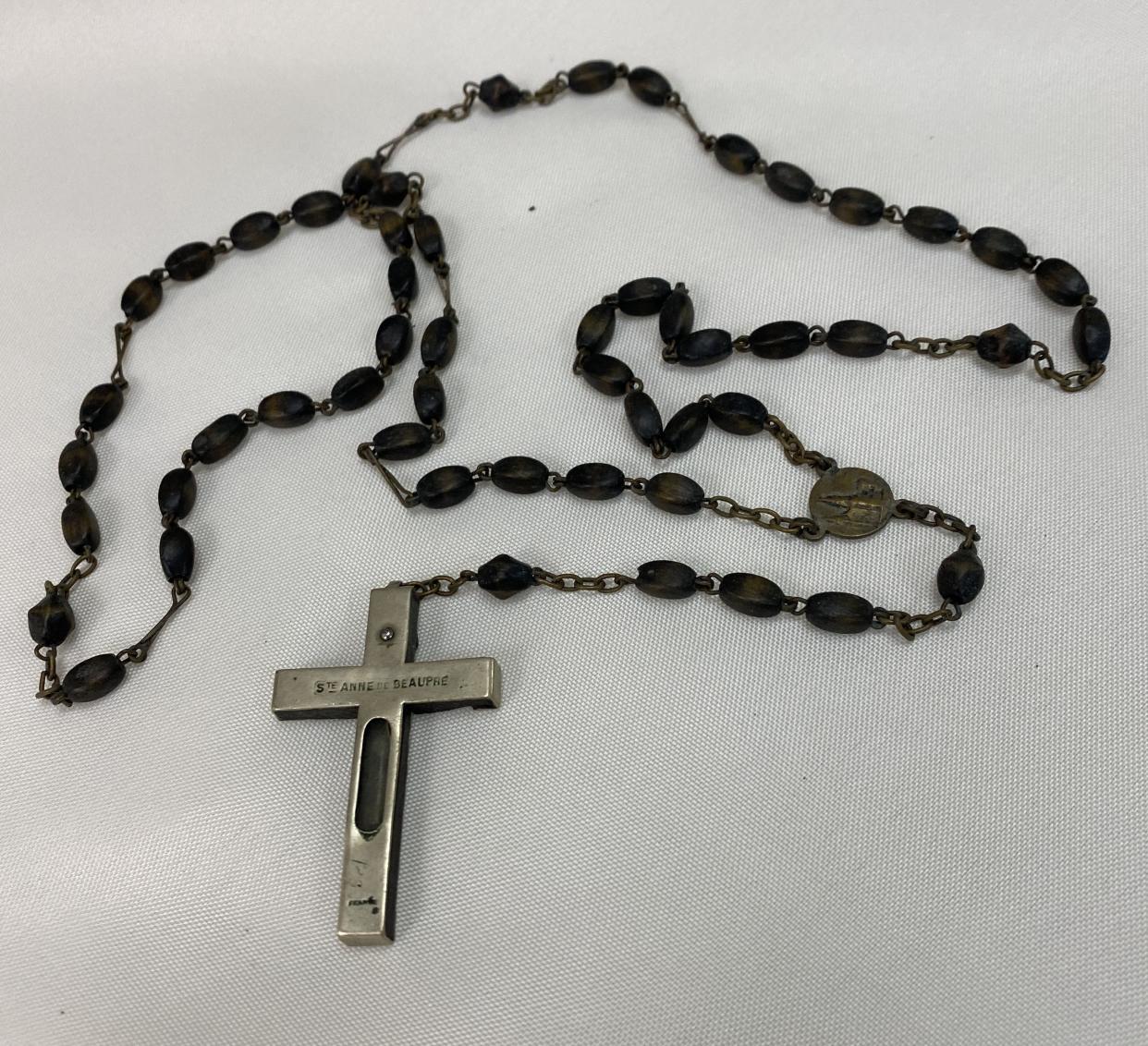 Akron funeral director David Anthony has the rosary that his father, Paul, was holding when he was killed in 1974.