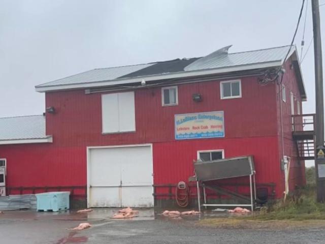 Post-tropical storm Fiona ripped sheets of steel off the roof of this lobster pound in Lismore, N.S.  (Submitted - image credit)