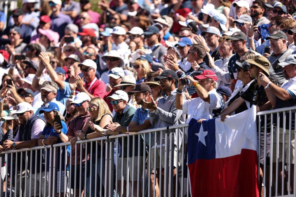 Fans cheer at the 1st tee box during the second round of the Presidents Cup at Quail Hollow Golf Club in Charlotte, N.C., on Friday, September 23, 2022.