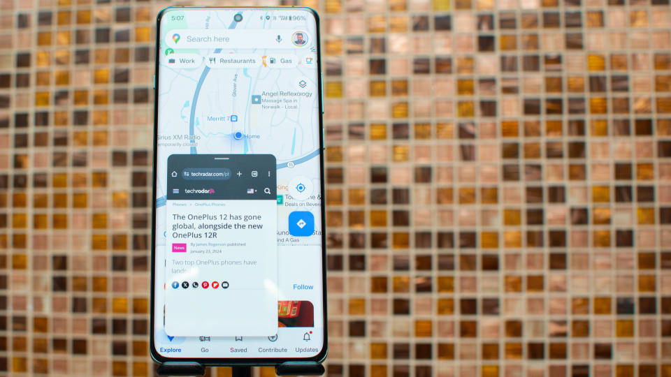 OnePlus 12 showing multi window with maps and TechRadar.com on the browser