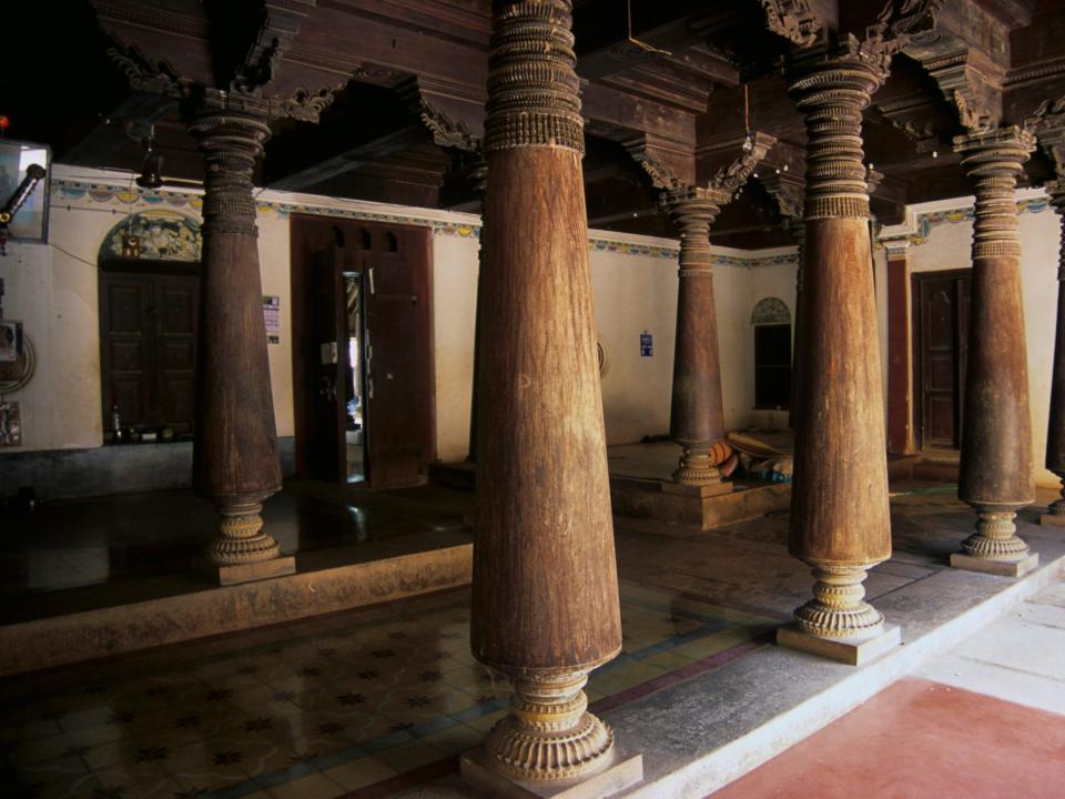 Wooden pillars inside a Chettinad mansion in 2000.
