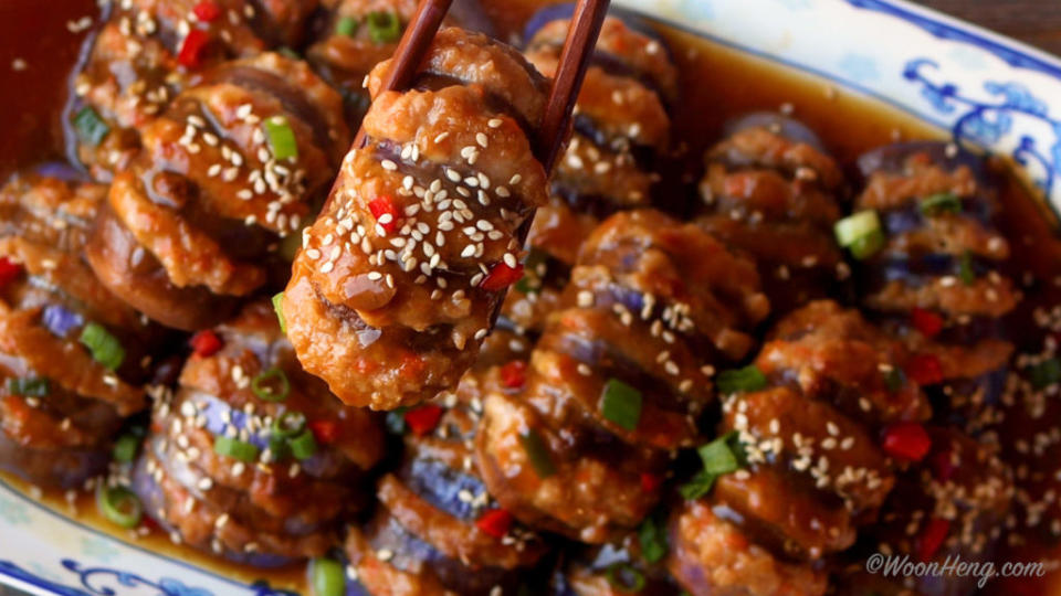 slices of eggplant stuffed with vegan pork sprinkled with chives and sesame seeds