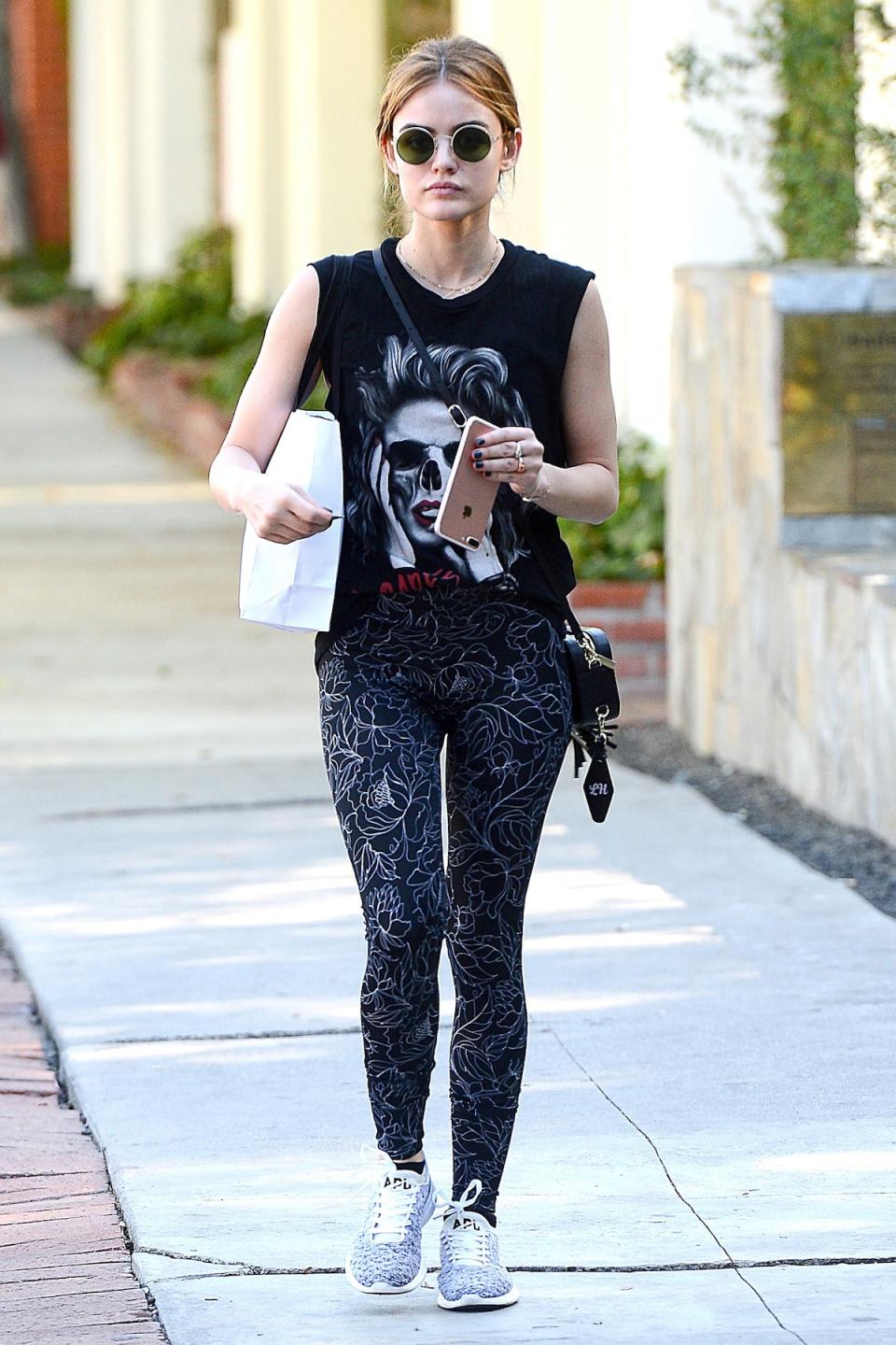 <p>Lucy Hale shops at Violet Gray on Melrose in APL TechLoom Phantoms. (Photo: AKM-GSI) </p>