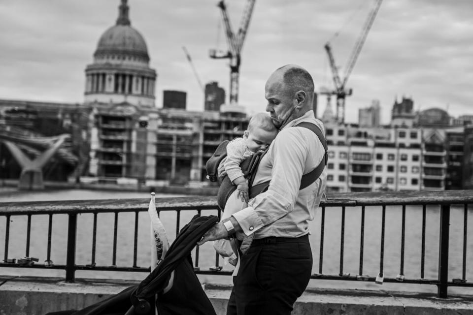 David Cookson checks on his sleeping daughter Clementine