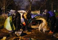 French police clear out migrants from an illegal camp in north Paris