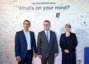 German Interior Minister Thomas de Maiziere (C), Eva- Maria Kirschsieper, Facebook head of public policy D-A-CH (R) and Martin Ott, Facebook managing director central Europe, pose during a vistit at the Facebook office in Berlin, Germany August 29, 2016. REUTERS/Stefanie Loos