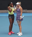 United States' Coco Gauff, left, and compatriot Caty McNally talk in their third round doubles match against Japan's Shuko Aoyama and Ena Shibahara at the Australian Open tennis championship in Melbourne, Australia, Monday, Jan. 27, 2020. (AP Photo/Dita Alangkara)