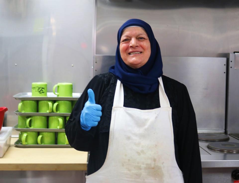 Fatema el Haj, a mother of eight who emigrated from Syria to Saint John in 2016, is one of the newer volunteers at the food bank, where she's been making friends and learning a little bit of English. 