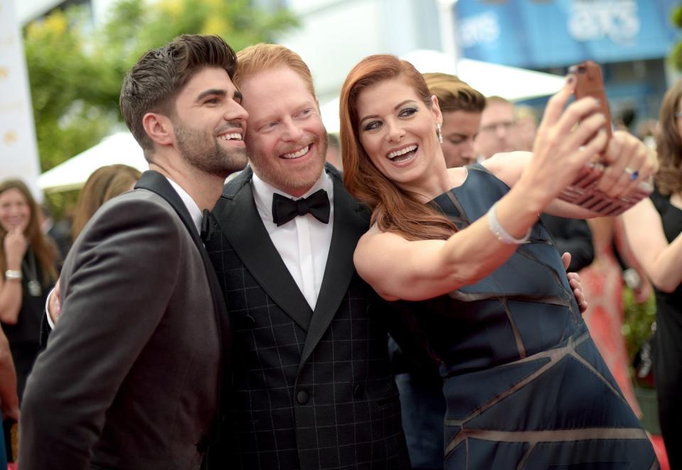 Justin Mikita, Jesse Tyler Ferguson, and Debra Messing