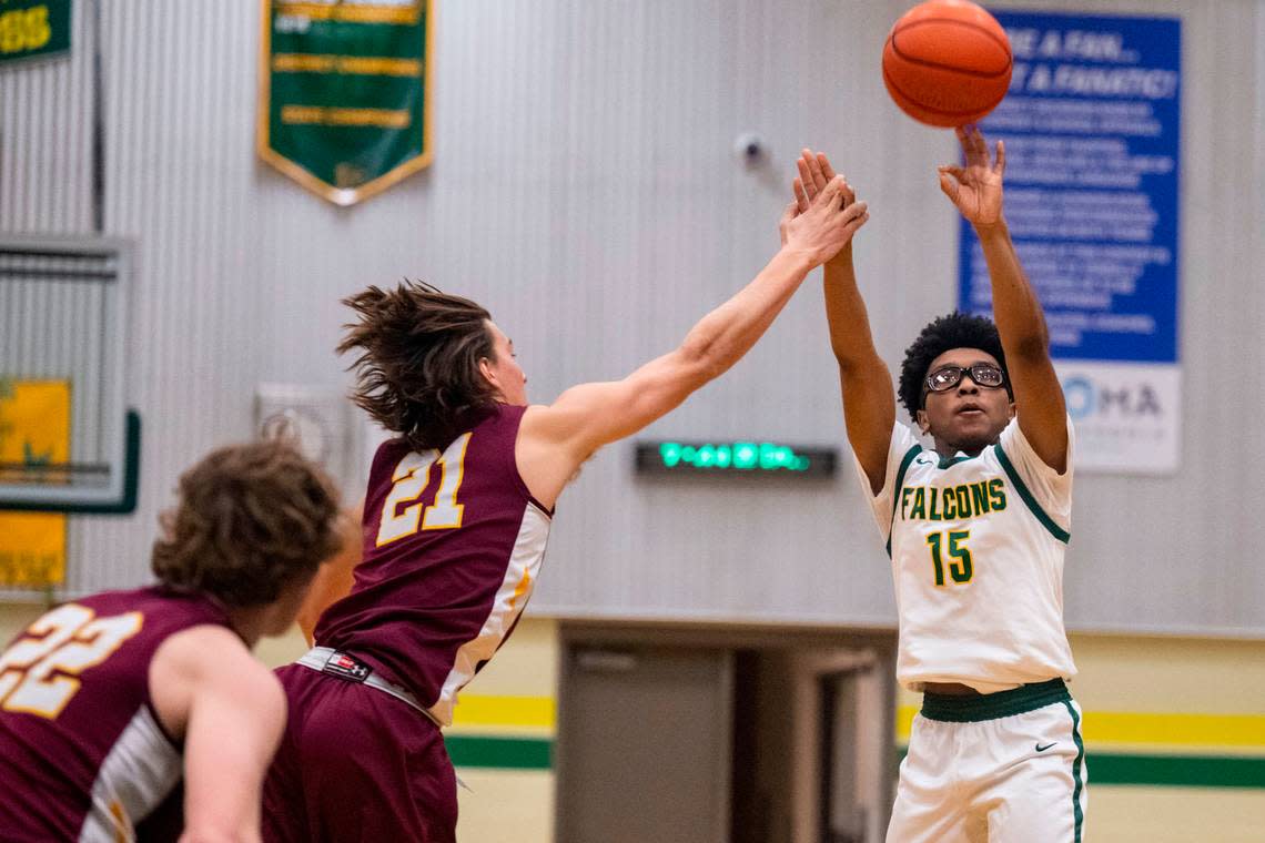 Foss guard Aiden Finley is fouled by Enumclaw’s Karson Holt as he attempts a 3-pointer during the third quarter of 2A SPSL game on Tuesday, Jan. 24, 2023, in Tacoma, Wash.