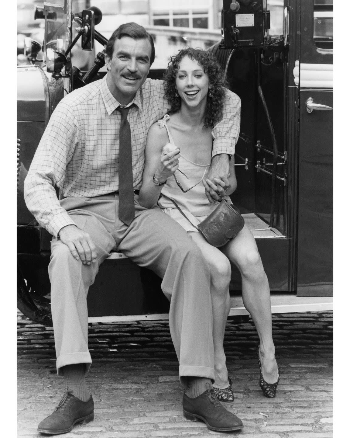 a man and a woman sitting on a bench