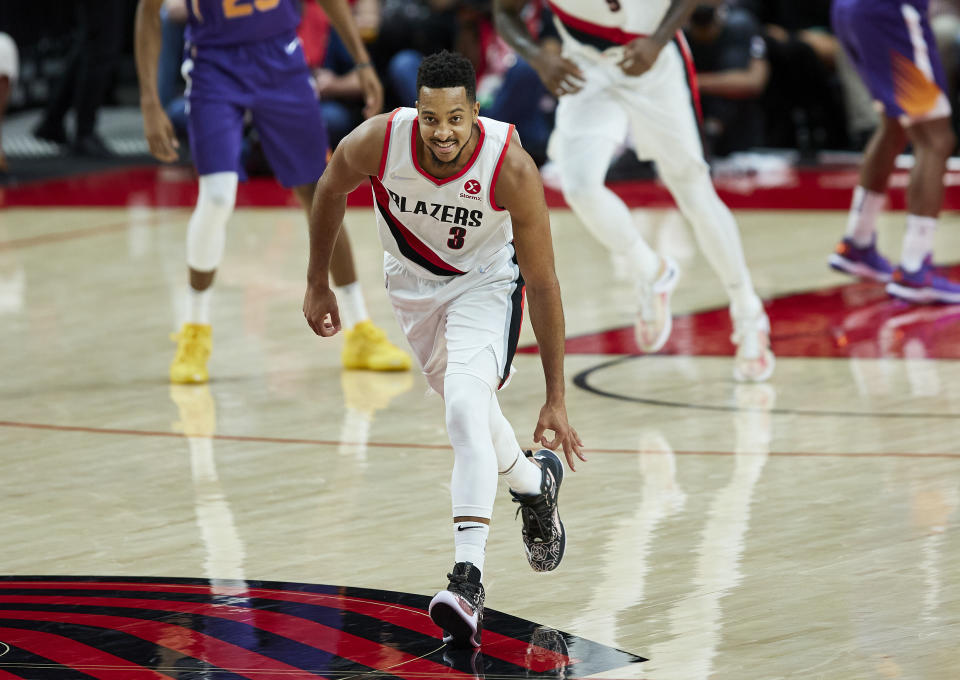 Portland Trail Blazers guard CJ McCollum gestures after making a 3-point basket against the Phoenix Suns during the second half of an NBA basketball game in Portland, Ore., Saturday, Oct. 23, 2021. (AP Photo/Craig Mitchelldyer)