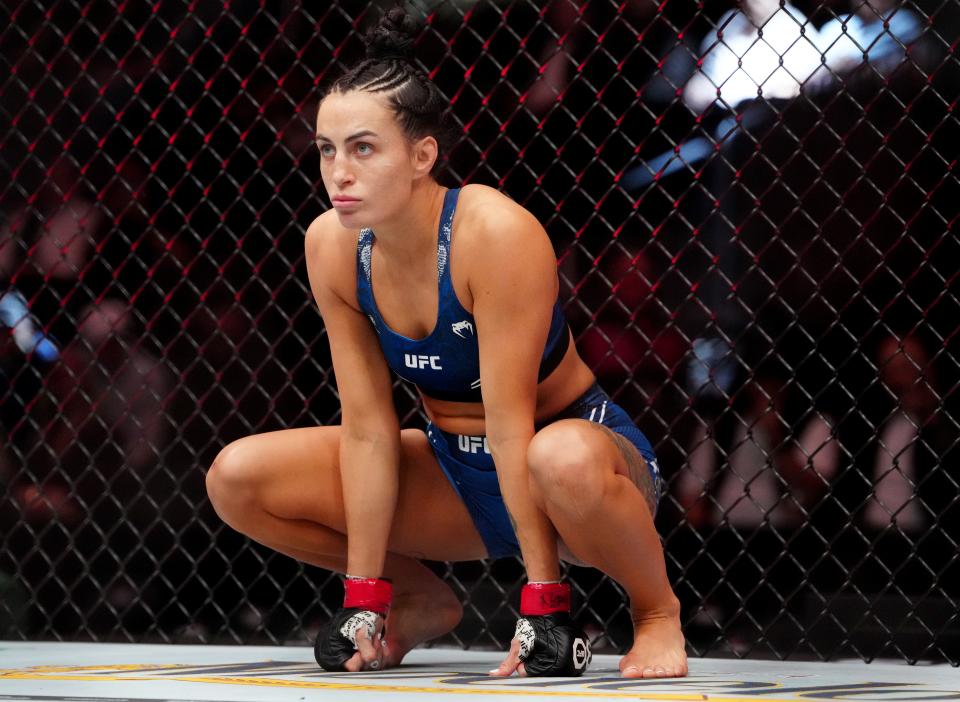 Dec 16, 2023; Las Vegas, Nevada, USA; Casey O’Neill (red gloves) during UFC 296 at T-Mobile Arena. Mandatory Credit: Stephen R. Sylvanie-USA TODAY Sports