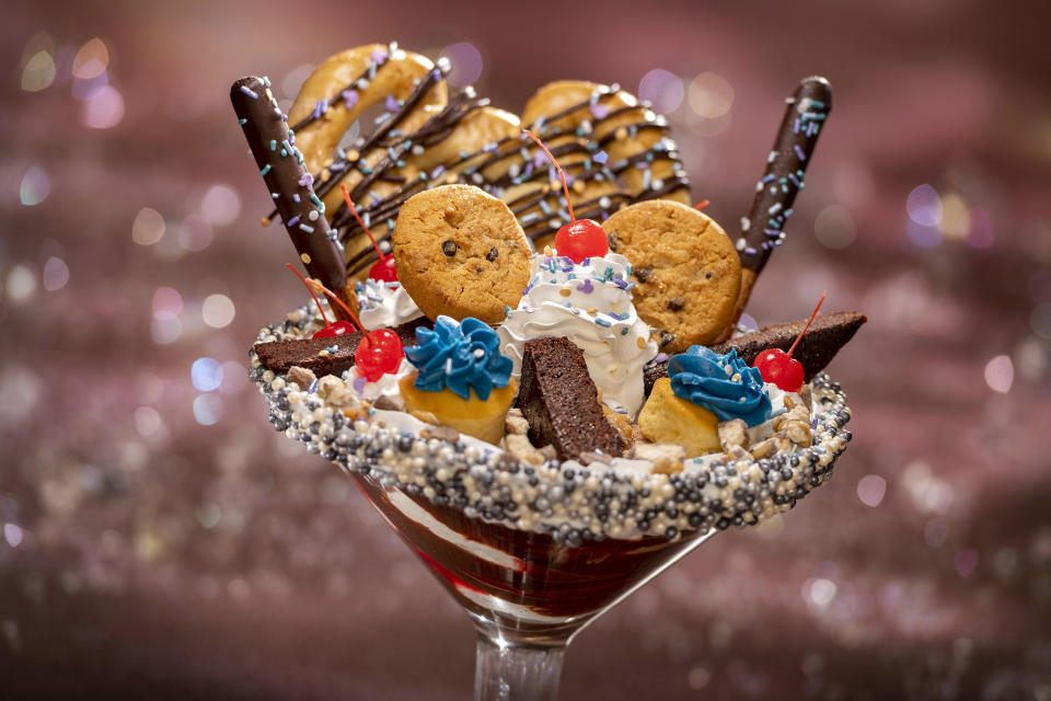 Cheers to 50 Years! This sundae, served at Magic Kingdom Park, contains everything from cupcakes to a full-sized Mickey pretzel. (Photo: Walt Disney World Resort)