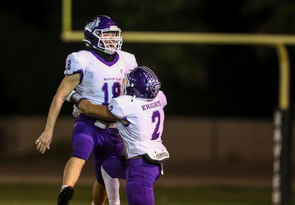 Shadow Hills' Jeremiah Peffers (18) celebrates an interception with Jose Gonzalez (2) during the third quarter of their game at Xavier College Preparatory High School in Palm Desert, Calif., Thursday, Sept. 29, 2022. 