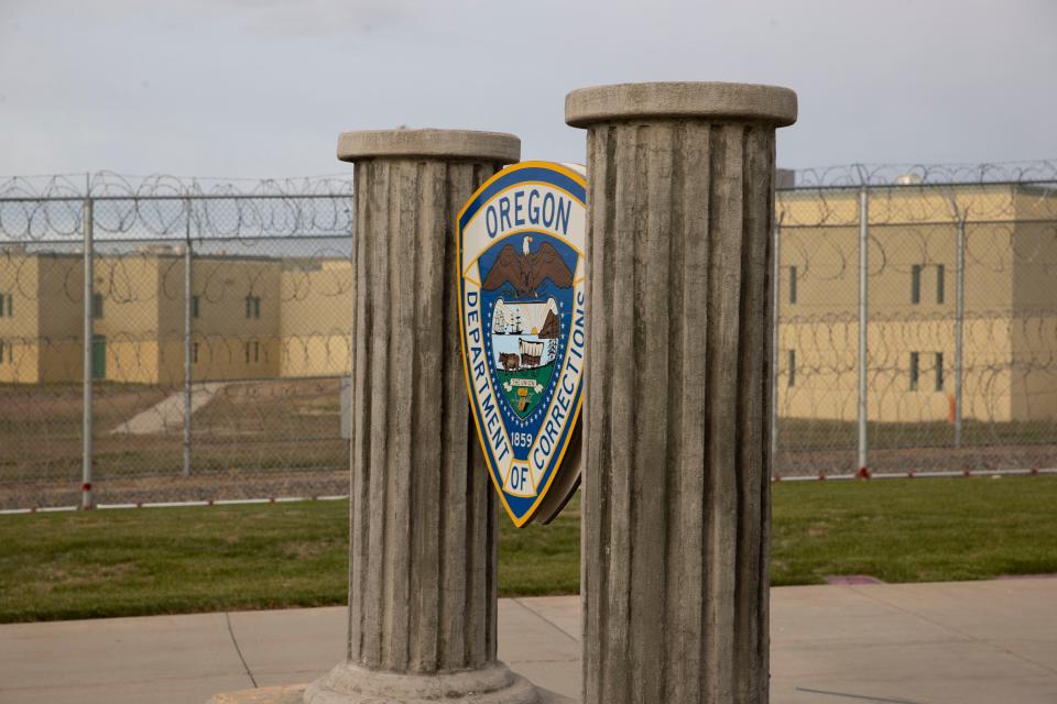 Columns and the Oregon Department of Corrections sign greet visitors at Snake River Correctional Institution in Ontario.