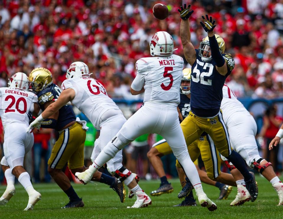 Notre Dame’s Bo Bauer (52) defends Wisconsin's Graham Mertz (5) during the Notre Dame vs. Wisconsin NCAA football game Saturday, Sept. 25, 2021 at Soldier Field in Chicago. 