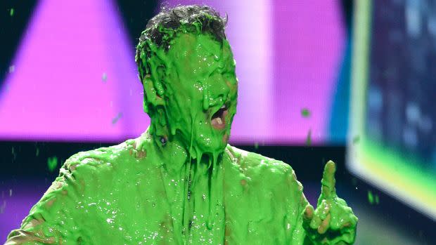 A man covered in green slime